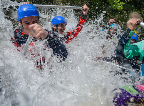 Extreme water splash on to a rafting boat