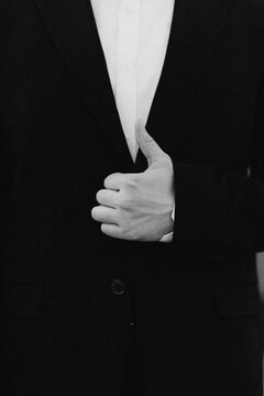 Man in suit giving thumbs up gesture