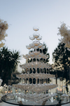 Champagne tower with coupes for wedding celebration