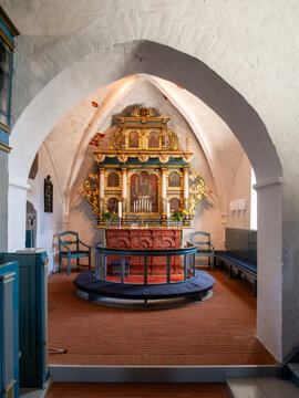 Altarpiece beneath pointed chancel arch in Sejer&oslash; Kirke, Sejerby, Sejer&oslash; island in Kattegat, Denmark
