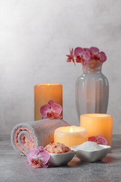 Sea salt, towels, orchid flowers, and burning candles.