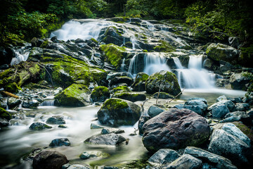 Waterfall and Cascading Water over rocks © Joe