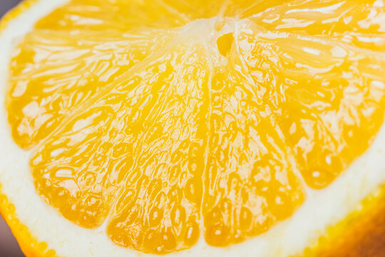 Close-up of fresh halved orange showing juicy pulp