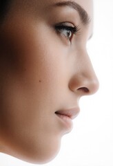 Fototapeta premium Profile view of a woman's eyes with perfect skin and makeup