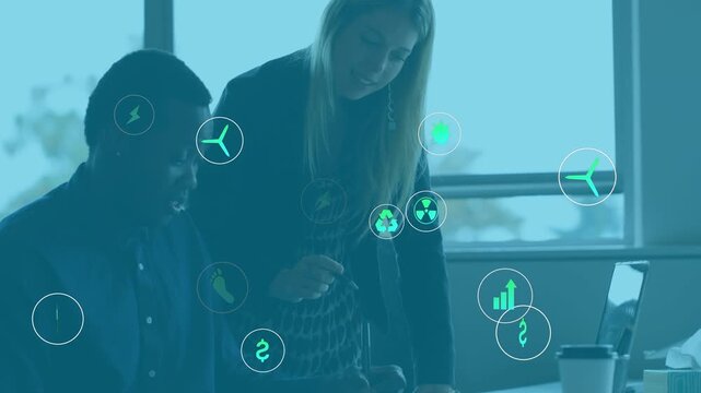 Business team meeting green icon emerging sparking eco icons drifting over laptop showing CO2 data