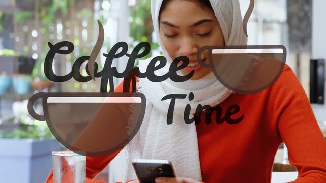 Woman sitting reading message, smiling, looking up, tapping phone while Coffee Time decal staying
