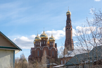 Orthodox church with golden domes under blue sky © Katyam1983