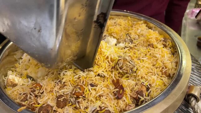 Vegetable Biryani served at an Indian event; a traditional flavorful rice dish with spices and vegetables, presented for guests during a grand celebration or wedding.