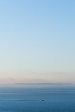 Wide view of a tug boat traveling through Puget Sound