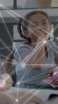 Vertical video: Schoolgirl writing book node-net moving across frame causing eye rub and thought