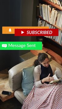 Vertical video: Woman reading on sofa by shelf, phone causing media badges hiding book then fading