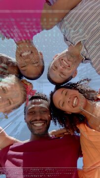 Vertical video: Six friends moving to cam leaning in hugging smiling under glass roof glare for ads