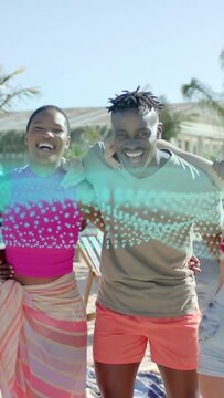 Vertical video: Man holding cell while woman smiling and posing for travel, teal wave hiding pair
