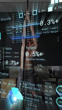 Vertical video: Man gripping rope, starting climb in gym training, finance HUD layering charts pct