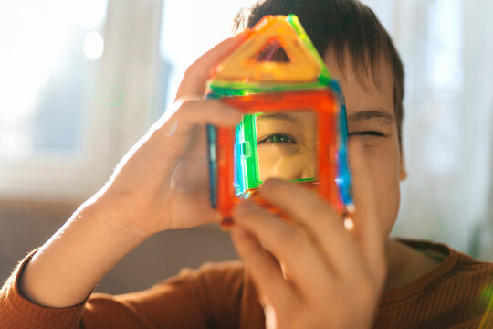 Looking through a colorful magnetic building block toy