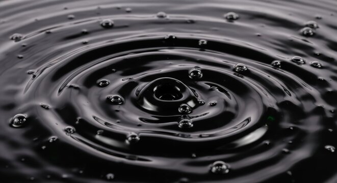 Macro Shot of Thick Black Crude Oil Swirling with Iridescent Highlights and Viscous Motion