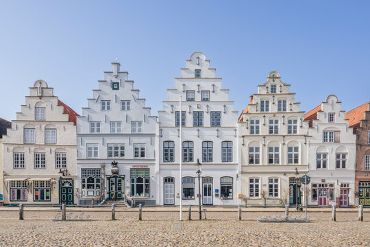 Historic white houses with stepped gables in Friedrichstadt Germany