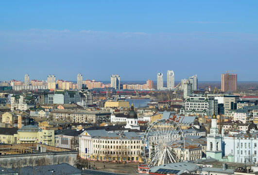 Kyiv cityscape with ferris wheel and architecture on the right bank