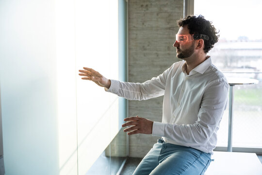 Professional in office working with augmented reality