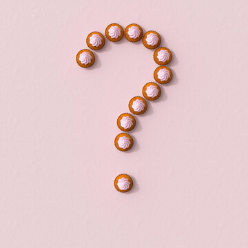 Question mark made of pink cupcakes on pink background