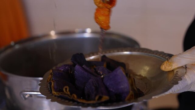 Close-up of dried stuffed vegetables being placed into boiling water, showing traditional preparation method, rehydration process, and authentic Turkish cuisine cooking technique.