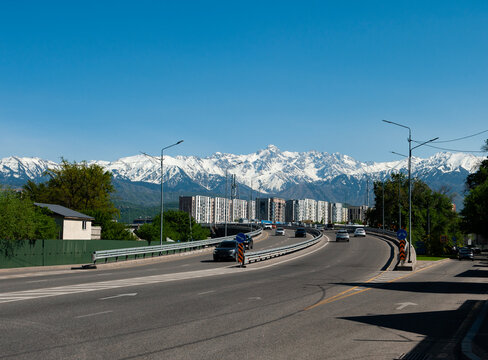 City wiew with big road, mountains 