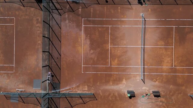 Aerial Top Down View of Clay Tennis Courts Maintenance, Camera Moving Forward