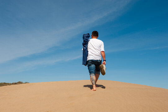 running up man in the desert