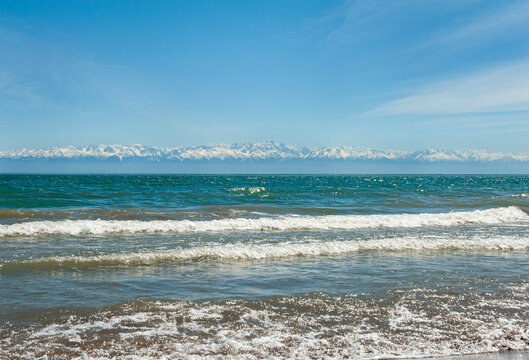 beach and sea with mountain snowy praks