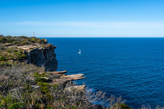 Dramatic coastal cliffs along Fairfax Walk in Manly, Sydney, Australia