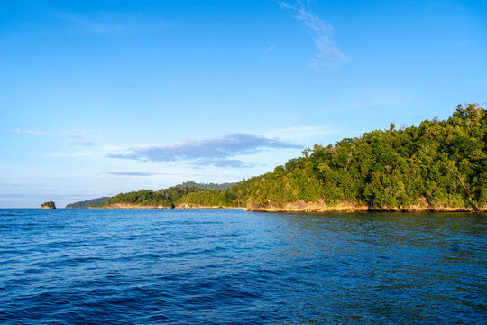Sunset over Waleakodi Island, Togian archipelago, Sulawesi, Indonesia coastal landscape