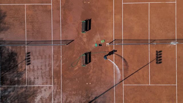 Aerial Top Down View of Clay Tennis Courts Maintenance, Camera Moving Forward