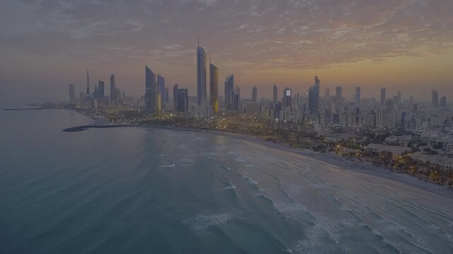 Kuwait city skyline at sunrise, aerial view with vibrant ocean waves and coastal urban landscape