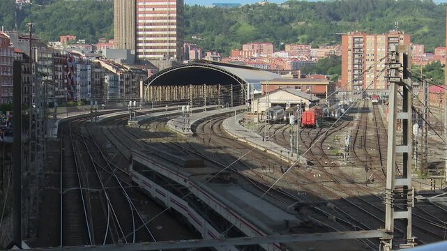 Commuter train arriving at abando station in bilbao