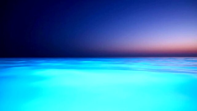 Serene ocean water at sunset horizon.