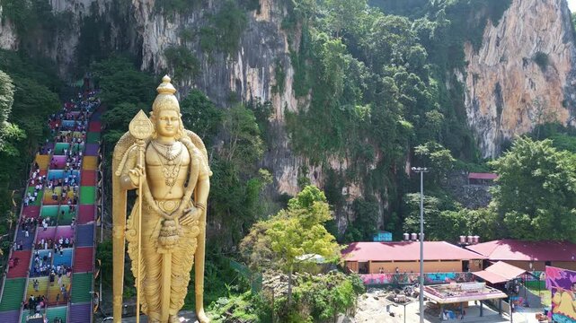 Aerial of Golden Statue in Batu caves Kuala Lumpur 4k drone