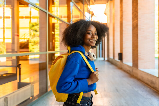 Young african student smiling on university campus