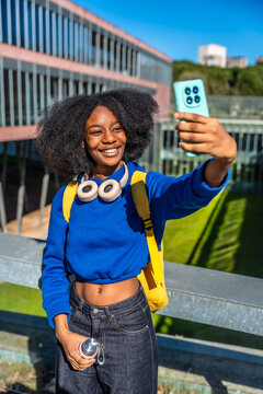 Young student taking a selfie on university campus