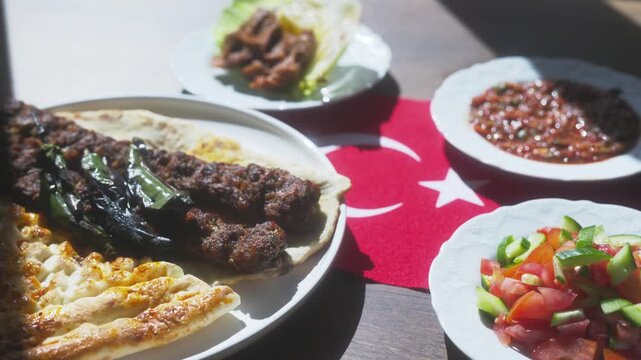 Close-up of Adana kebab menu on the Turkish flag
