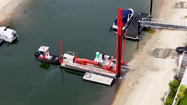 Aerial View of a Piling Rig Barge Dredging a Gold Coast Canal