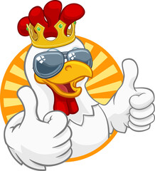 A chicken rooster cockerel bird cartoon character in a kings gold crown and cool shades or sunglasses giving a double thumbs up © Christos Georghiou