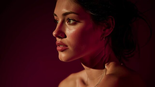 Cinematic Profile of Beautiful Woman Wearing Elegant Rings in Moody Lighting Video.
