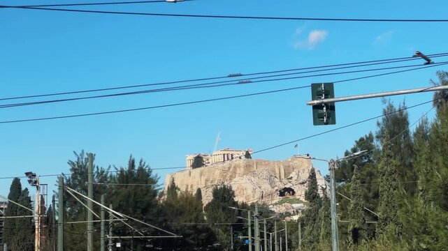 Drive pov in Athens Greece with picturesque view of Acropolis on sunny summer day