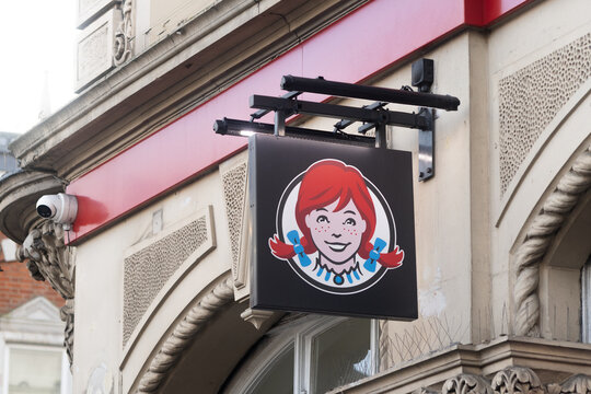 Wendy&rsquo;s fast food restaurant sign on building exterior