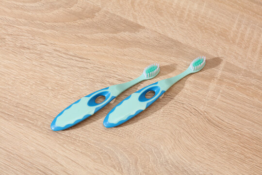 Children's toothbrushes on a table. Top view