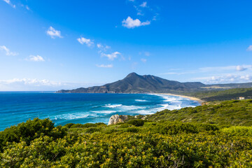 Fototapeta premium Panoramic view of Dido beach in Portixeddu Bay with Punta Su Guardianu hill in the background, west of Sardinia Island, Italy