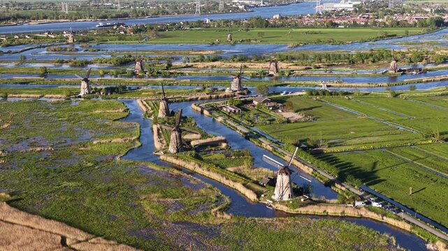 Aerial view of kinderdijk windmills pumping water in dutch polder landscape