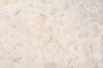 Fototapeta premium Light beige gray textured plaster wall background with subtle brush strokes and neutral abstract surface for design backdrop
