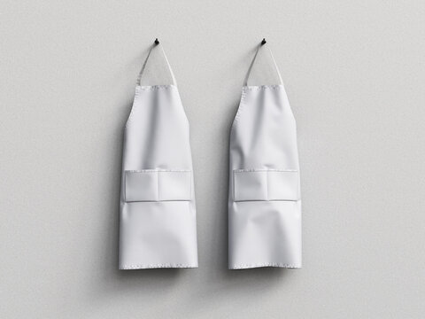 White blank kitchen apron hanging on wall. 3D render.