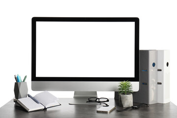 Fototapeta premium Table with blank computer monitor, mobile phone and eyeglasses isolated on white background